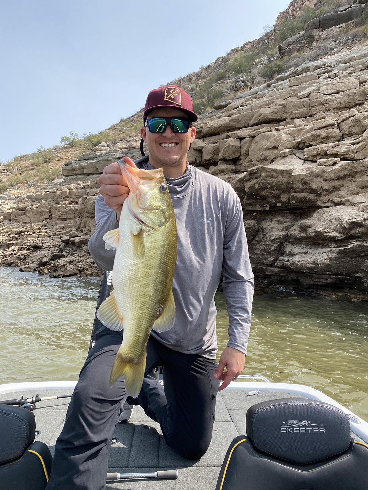 Nick Teschler, holding a 4lb bass at Lake Pleasant in the fall with some dirty water