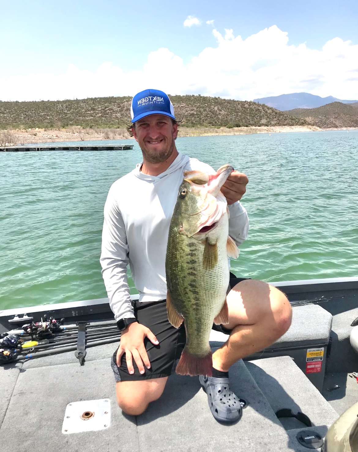 Conrad Demecs holding up a 9lb bass he caught in the Summer at Roosevelt Lake