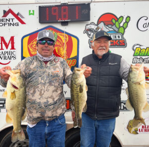 Jacob and Keith Lute holding 3 of their 5 winning fish at Martinez Lake for first stop of the Cactus Cup Team Trail 