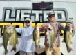 Winners Cody and Josh holding a 25lb bag at Martinez Lake