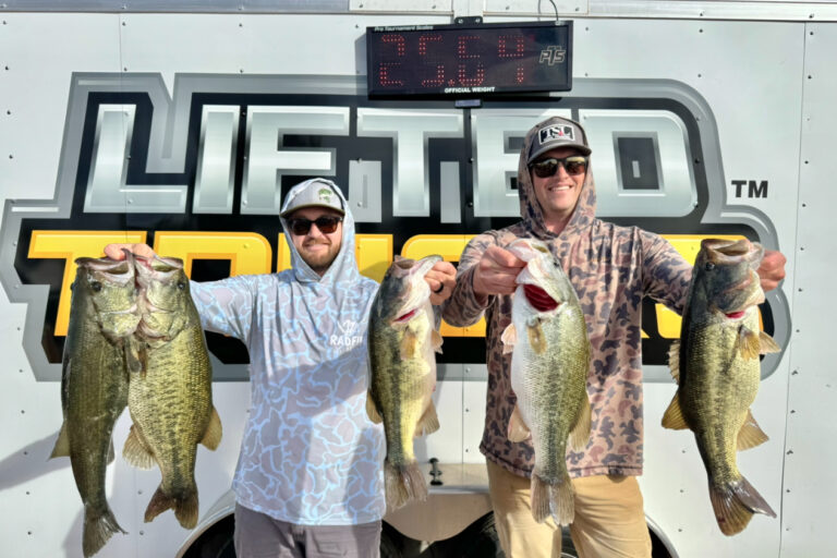 IMG_5315 Winners Cody and Josh holding a 25lb bag at Martinez Lake