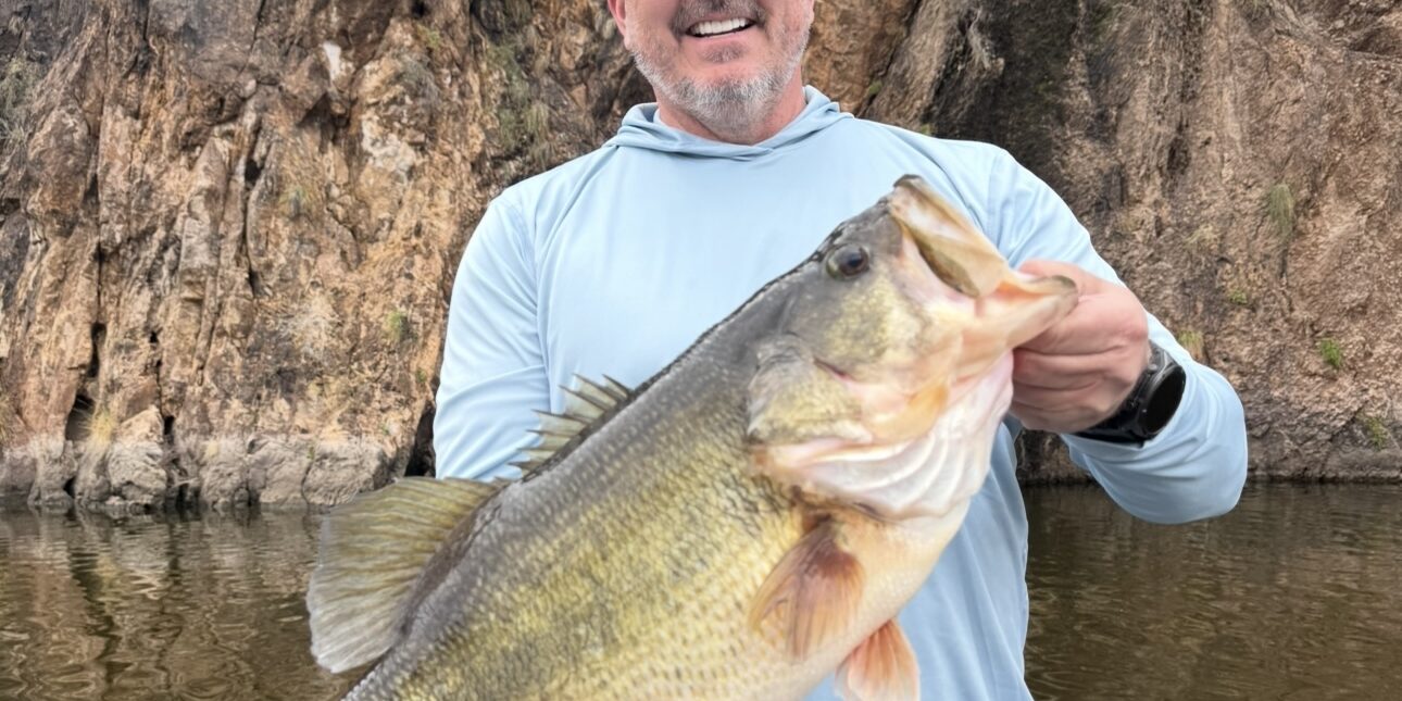 Robert holding a 10lb largemouth bass